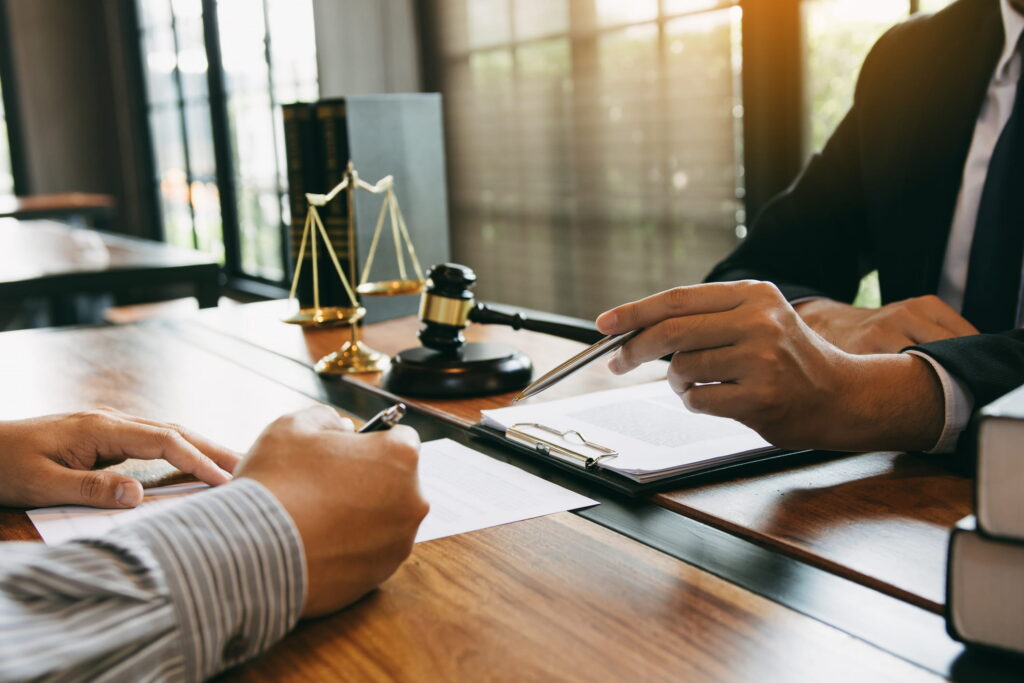 legal assistance, person going over legal documents with attorney